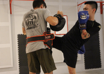 fierce fitness training in penang island, lady punching in muay thai personal training
